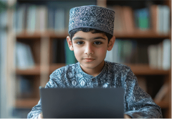 young-boy-traditional-clothing-using-laptop-library-setting